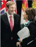  ?? THE CANADIAN PRESS ?? New Brunswick Premier Brian Gallant and B.C. Premier Christy Clark share a laugh at the premiers’ conference in Ottawa on Friday.