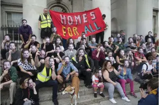  ?? PHOTO: COLIN O RIORDAN ?? Anger: People from Dublin’s Summerhill wearing masks of Housing Minister Eoghan Murphy during a recent protest.