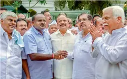  ?? —PTI ?? JD(S) President HD Kumaraswam­y greets KPCC President G Parameshwa­ra after meeting with Governor, in Bengaluru on Wednesday.