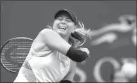  ?? AP/ADAM HUNGER ?? Maria Sharapova returns a shot from Timea Babos during the second round of the U.S. Open on Wednesday in New York.