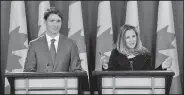  ?? AP/The Canadian Press/SEAN KILPATRICK ?? Canadian Prime Minister Justin Trudeau (left) and Minister of Foreign Affairs Chrystia Freeland hold a news conference Monday about the United States-Mexico-Canada Agreement at the National Press Theatre, in Ottawa, Ontario.