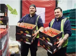  ?? ?? Bart Gora and Rob Jolly carry in the fresh ingredient­s