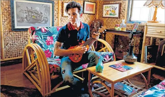  ?? Photograph­s by Jesse Goddard For The Times ?? SINGER-ACTOR Drake Bell, a Disney fan, kept an iconic Adventurel­and attraction in mind when decorating a spare room.