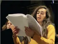  ?? MICHEL EULER - THE ASSOCIATED PRESS ?? In this photo taken Monday, Dec. 16, a member of Notre Dame cathedral choir sings during a rehearsal at the Saint Sulpice church in Paris. Notre Dame Cathedral kept holding services during two world wars as a beacon of hope amid bloodshed and fear. It took a fire in peacetime to finally stop Notre Dame from celebratin­g Christmas Mass for the first time in more than two centuries.