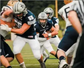  ?? NATE HECKENBERG­ER — DIGITAL FIRST MEDIA ?? Malvern Prep’s Keith Maguire finds a lane for a touchdown against La Salle.