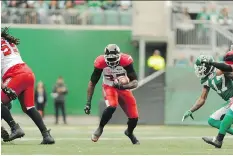  ?? MARK TAYLOR/THE CANADIAN PRESS. ?? Calgary back Jerome Messam was able to run through some huge gaps Sunday against host Saskatchew­an.