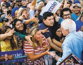  ?? Marcus Yam Los Angeles Times ?? SEN. BERNIE SANDERS greets supporters in Long Beach last month. In addition to adding homes, his new proposal would cap annual rent increases at 3%.