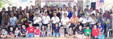  ??  ?? Dennis (seated sixth left) and Gerawat (seated seventh left) pose with other PBB members and their families during the Family Day in conjunctio­n with Malaysia Day yesterday.