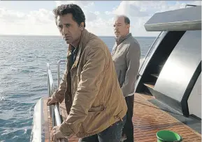  ??  ?? Cliff Curtis, left, and Ruben Blades take to the open water in the prequel series, Fear the Walking Dead. Richard Foreman Jr./AMC