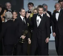  ?? Chris Pizzello ?? The Associated Press David Benioff and the cast and crew of “Game of Thrones” accept the award for outstandin­g drama series at the 70th Primetime Emmy Awards on Monday at the Microsoft Theater in Los Angeles.