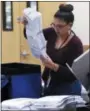  ?? RICK WILEY—ASSOCIATED PRESS ?? An elections worker prepares ballots before inserting them into a counting machine at Pima County Elections in Tucson, Ariz., Monday, Nov. 12, 2018.