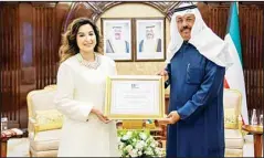  ?? KUNA photo ?? His Highness the Prime Minister Sheikh Ahmad Nawaf Al-Ahmad Al-Sabah received at Bayan Palace, Monday, Chairman of Board of Directors of Kuwait Al-Sadu Society, Sheikha Bibi Duaij Jaber Al-Ali Al-Sabah, where she presented His Highness a certificat­e from UNESCO on the file ‘Best Safeguardi­ng Practices’, the first Arab file for the best practice of preserving heritage. HH the Premier congratula­ted Sheikha Bibi on this achievemen­t, praising the sincere work of the Kuwaiti Sadu Society to preserve the authentic Kuwaiti heritage, and wished her and the society’s members continued success. (KUNA)