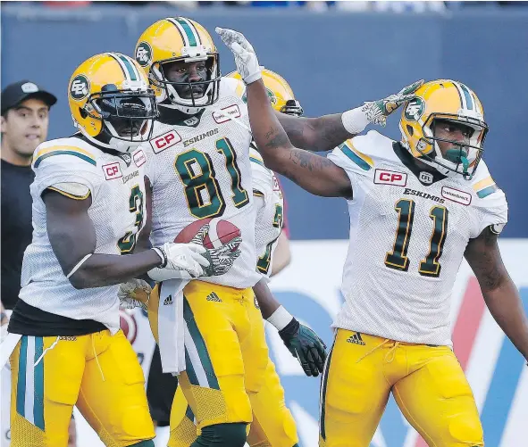  ?? — CP FILES ?? Eskimos receiver D’haquille Williams, centre, celebrates his major with Natey Adjei, left, and K.J. Maye in pre-season action against the Blue Bombers in Winnipeg, Thursday. With Darrel Walker now in the NFL, the Esks hope newcomer Williams can fill...