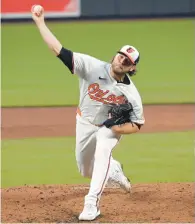  ?? KENNETH K. LAM/BALTIMORE SUN ?? Orioles starting pitcher Corbin Burnes wasn’t as sharp in his second start of the season as his first. He allowed two runs on nine hits in 5.2 innings against Kansas City on Wednesday.