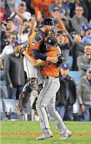  ?? [AP PHOTO] ?? Houston Astros catcher Brian McCann and starting pitcher Charlie Morton celebrate after defeating the Los Angeles Dodgers, 5-1, Wednesday night in Game 7 of baseball’s World Series. It was Houston’s first World Series championsh­ip.