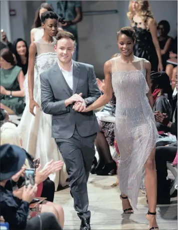  ??  ?? ‘HORRIFIC PAST’: Fashion designer Ryan Keys on the catwalk.