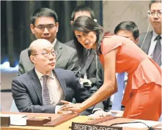  ?? MARY ALTAFFER, AP ?? Nikki Haley, the U. S. ambassador to the United Nations, speaks to China’s Liu Jieyi before a Security Council vote Saturday.