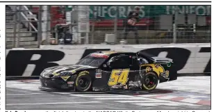  ??  ?? Kyle Busch crosses the finish line to win the NASCAR Xfinity Series race Monday night in Concord, N.C. Busch passed Austin Cindric on the final lap to take the lead.
(AP/Gerry Broome)