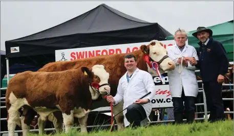  ??  ?? Champion Simmental at Swinford Agricultur­al Show was Seepa Aster and her 7 month old calf Seepa Kodak for Paddy Hennelly, Rosses Point, Sligo with John Anderson and Michael Oliver Swinford Agricultur­al Show Committee.