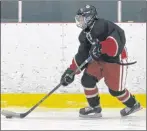  ?? JASON SIMMONDS/JOURNAL PIONEER ?? Dallas Hughes carries the puck for Kensington against Bedford on Saturday night. The two teams played to a 5-5 tie at Community Gardens. This is the 50th year for the Kensington, P.E.I.-Bedford, Que., Peewee Friendship Hockey Exchange.