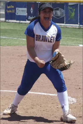  ??  ?? Brawley Union High’s Lilly Martinez reacts after recording the final out of the Wildcats’ second-round CIF-SDS Div. II game in Brawley on Saturday morning. KARINA LOPEZ PHOTO