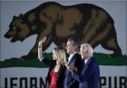  ?? Wally Skalij
/ Los Angelestim­es /TNS ?? President Joe Biden (right) claps onstage with California Gov. Gavin Newsom and his wife, Jennifer Siebel Newsom, during a campaign event at Long Beach City College, in September.