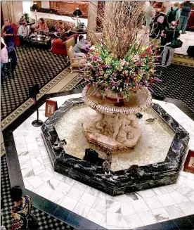  ?? St. Louis Post-Dispatch/TNS/GABE HARTWIG ?? The famous Peabody ducks spend their days paddling around the historic hotel’s ornate lobby fountain.