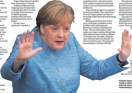  ?? Photo / Bloomberg ?? German chancellor Angela Merkel wants to enforce private sector haircuts and sovereign debt restructur­ing before any rescue.