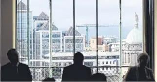  ?? PHOTO: JUSTIN FARRELLY ?? Land: The Dublin skyline is seen through a window during the launch of Project Ireland 2040 yesterday.