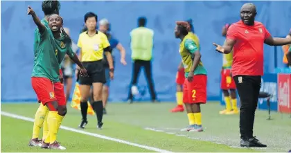  ?? Photo / AP ?? Cameroon’s Ajara Nchout (left) and head coach Alain Djeumfa react after a VAR decision.