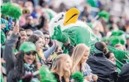  ?? ROBERTO E. ROSALES/JOURNAL ?? University of North Texas mascot Scrappy the Eagle crowdsurfs through the stands during the first half of Saturday’s New Mexico Bowl at Dreamstyle Stadium.