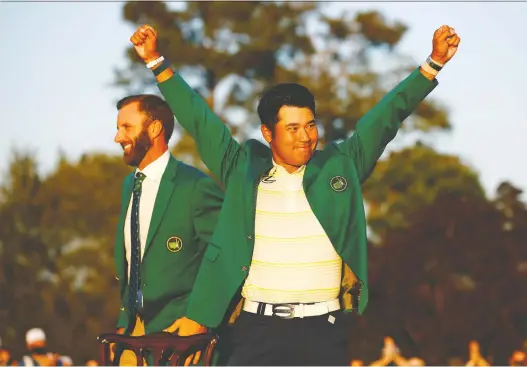  ?? JARED C. TILTON/GETTY IMAGES ?? Hideki Matsuyama celebrates after 2020 champion Dustin Johnson suits him up with the Green Jacket for winning the Masters by one stroke on Sunday.