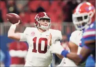  ?? Brynn Anderson / Associated Press ?? Alabama quarterbac­k Mac Jones works against Florida during the first half of the Southeaste­rn Conference championsh­ip game on Saturday in Atlanta.