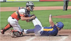  ?? MARK HOFFMAN / MILWAUKEE JOURNAL SENTINEL ?? Kenosha St. Joseph's Jack Grosz is tagged out at home by Webster catcher Trevor Gustafson during the first inning Wednesday. St. Joseph coach Zach Cunningham argued Grosz should have been safe because Gustafson improperly blocked the base path.