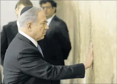  ?? THOMAS COEX/ AGENCE FRANCE- PRESSE VIA GETTY IMAGES ?? Prime Minister Benjamin Netanyahu praysWedne­sday at the Wailing Wall in Jerusalem following his party’s victory in Israel.