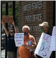  ?? (Arkansas Democrat-Gazette/Stephen Swofford) ?? Members of the Arkansas Women’s Action for New Directions protest Tuesday in support of the U.S. Postal Service in front of the post office on Kavanaugh Boulevard in the Hillcrest neighborho­od of Little Rock. Another group demonstrat­ed at the post office in the Heights neighborho­od of Little Rock.