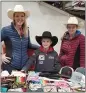  ?? JULIE ZEEB — RED BLUFF DAILY NEWS ?? Kamish Wagner, right, with her mother Adrienne Wagner, left, and brother Kanton, center, at a California High School Rodeo Associatio­n event.