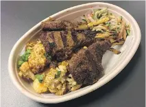  ?? PETER HUM ?? BK Jani at DeKalb Market Hall serves tender, spicy lamb chops arranged with some fried cauliflowe­r and shredded veg.