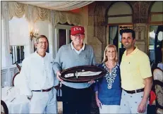  ??  ?? Barry
(from left) presented President Trump with a handmade knife commission­ed by Donald Trump Jr. on Dec. 31 at Mar-a-Lago. Barry’s wife Letha Barry (third from left) was in attendance.