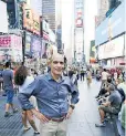  ??  ?? Host Geoffrey Baer in the middle of Times Square as it looks today.