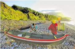  ?? —EV ESPIRITU ?? NO ESCAPING VIRUS In this photo taken before the pandemic struck, fishermen in Basco, Batanes, check their boats on the shores of Valugan Bay. The northernmo­st province of Batanes has largely contained the spread of COVID-19 for more than a year until this week’s outbreak.