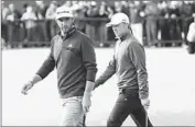  ?? Facundo Arrizabala­ga
European Pressphoto Agency ?? PAIRED players Dustin Johnson, left, and Jordan Spieth walk green on third day of play at St. Andrews.