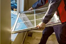  ?? Photovs/Getty Images/iStockphot­o ?? Replacing windows can potentiall­y qualify for an Energy Efficiency Home Improvemen­t Credit.