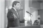  ?? SUN SENTINEL MIKE STOCKER / SOUTH FLORIDA ?? Gov. Ron DeSantis talks to the media on Thursday during an interfaith COVID-19 vaccinatio­n drive at the Aventura Turnberry Jewish Center in Aventura hosted in partnershi­p with a mosque and Black churches.