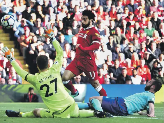  ?? Getty ?? A goal from Mohamed Salah, centre, in the 69th minute was his 30th in the league and 40th across all competitio­ns as Liverpool defeated Bournemout­h 3-0