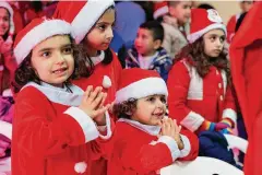  ?? Mohammad Zaatari/Associated Press ?? Lebanese children celebrate a Christmas party, at Saint-Joseph des Saints-Coeurs School in Ain Ebel, a Lebanese Christian border village with Israel, in south Lebanon, on Saturday. Christians in the border villages of south Lebanon prepared for a subdued Christmas under the shadow of the ongoing war in Gaza and its spillover in Lebanon.