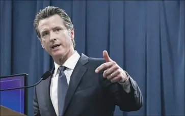  ?? Rich Pedroncell­i Associated Press ?? GOV. GAVIN NEWSOM enlisted Cal/OSHA to “get the word out” about his efforts to ensure businesses follow safety guidelines amid the COVID-19 pandemic. But the agency has been hobbled by cuts and vacancies.