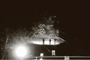  ?? Noah Berger / Associated Press ?? Bicyclists ride through the Montclair district of Oakland, Calif., where power had been turned off. Electricit­y has been cut to parts of Northern California in a bid to prevent wildfires.