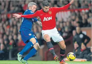  ??  ?? Cardiff days: Kevin McNaughton takes on Manchester United’s Robin van Persie