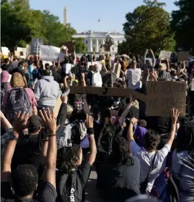  ?? Associated Press ?? Demonstrat­ors gather to protest the death of George Floyd, on June 1, near the White House in Washington. Floyd died after being restrained by Minneapoli­s police officers.